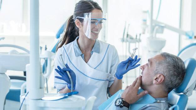 Dentist Talking with Patient
